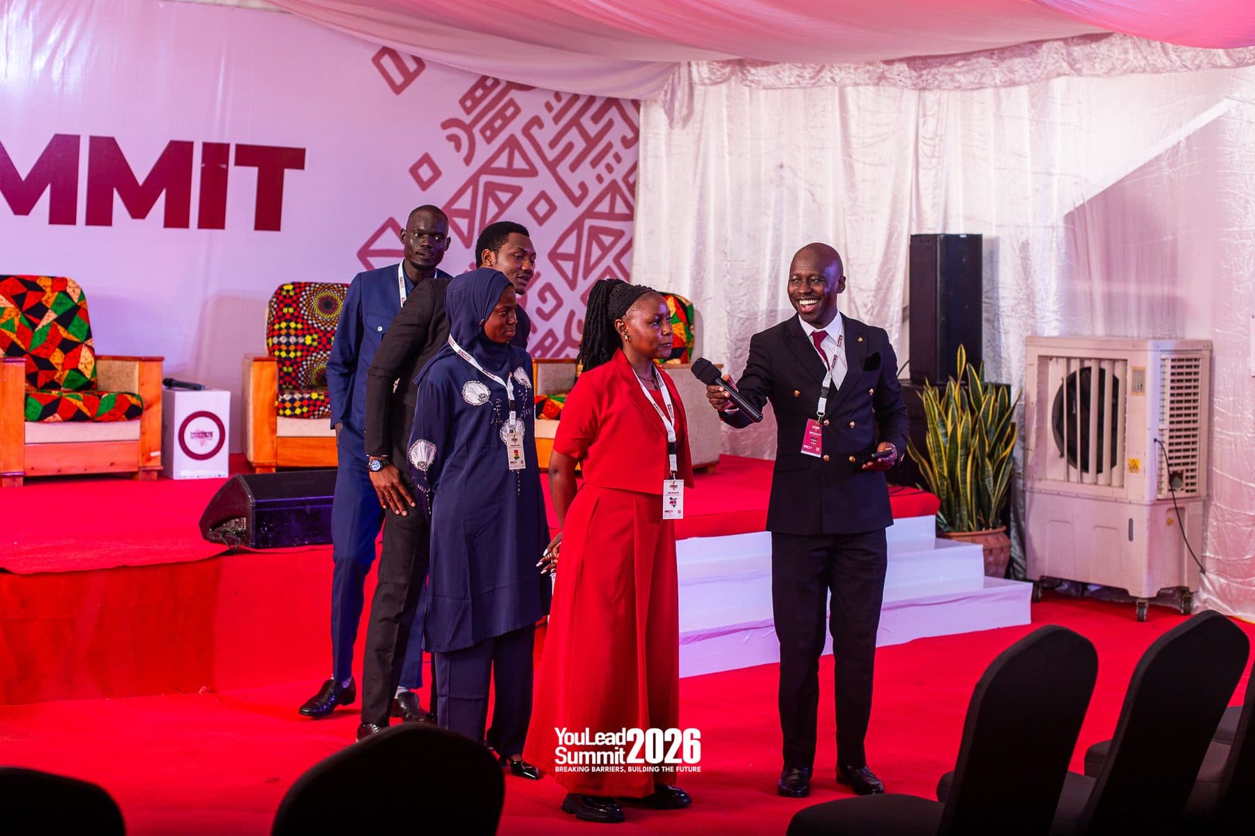 Delegates presenting on stage at the YouLead Summit 2026